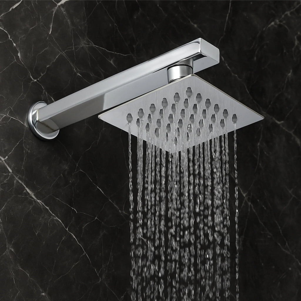 O chuveiro de teto Ultra de 4x4 polegadas em aço inoxidável 304, com braço de 9 polegadas, oferece um fluxo de água tipo chuva de alta pressão, desempenho durável e resistente à ferrugem, além de um elegante acabamento cromado para banheiros modernos.