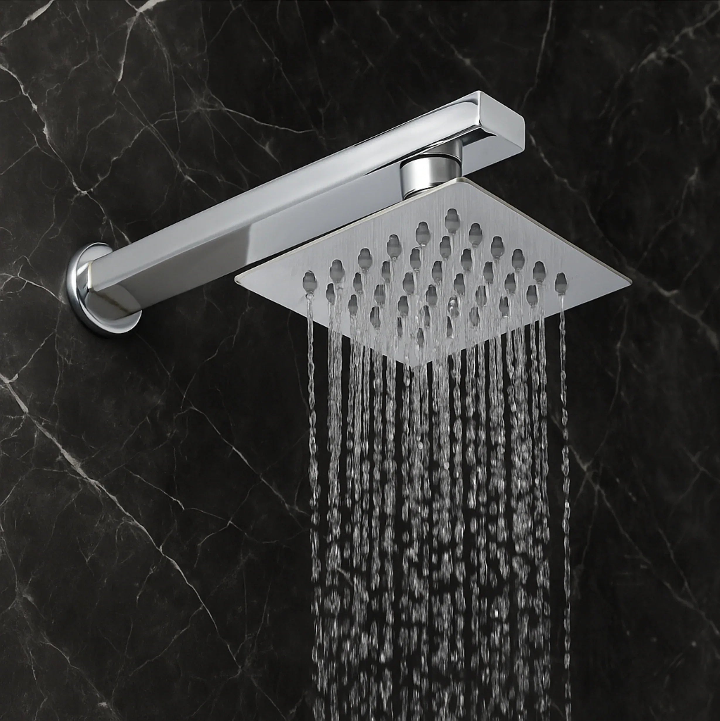 O chuveiro de teto Ultra de 4x4 polegadas em aço inoxidável 304, com braço de 9 polegadas, oferece um fluxo de água tipo chuva de alta pressão, desempenho durável e resistente à ferrugem, além de um elegante acabamento cromado para banheiros modernos.